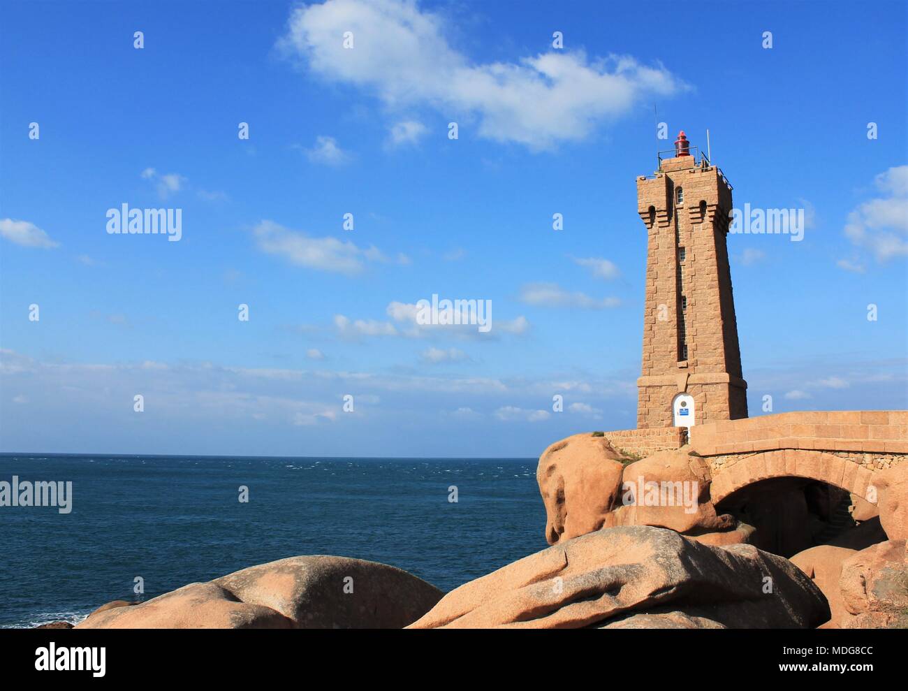 Mean Ruz lighthouse in Ploumanach on Pink Granite Coast, Brittany, France Stock Photo