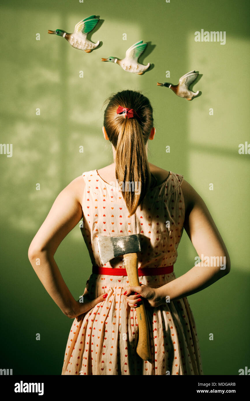 Woman with hatchet Stock Photo