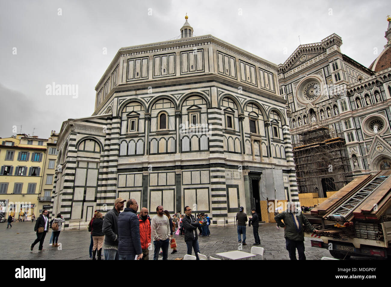 FLORENCE, ITALY -  NOVEMBER 7, 2017: people in duomo square the Baptisterium and Santa Maria del Fiore Cathedral in the background Stock Photo