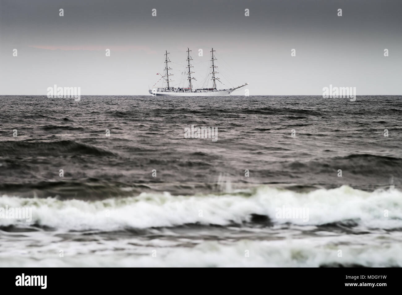 Sailing ship on the Baltic sea. Three-masted full-rigged Polish frigate ship Dar Mlodziezy on the high seas.Gdansk bay, Poland. Stock Photo