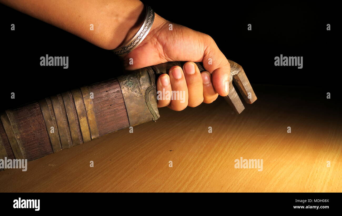 Hand Holding Acehnese traditional ancient machete Stock Photo