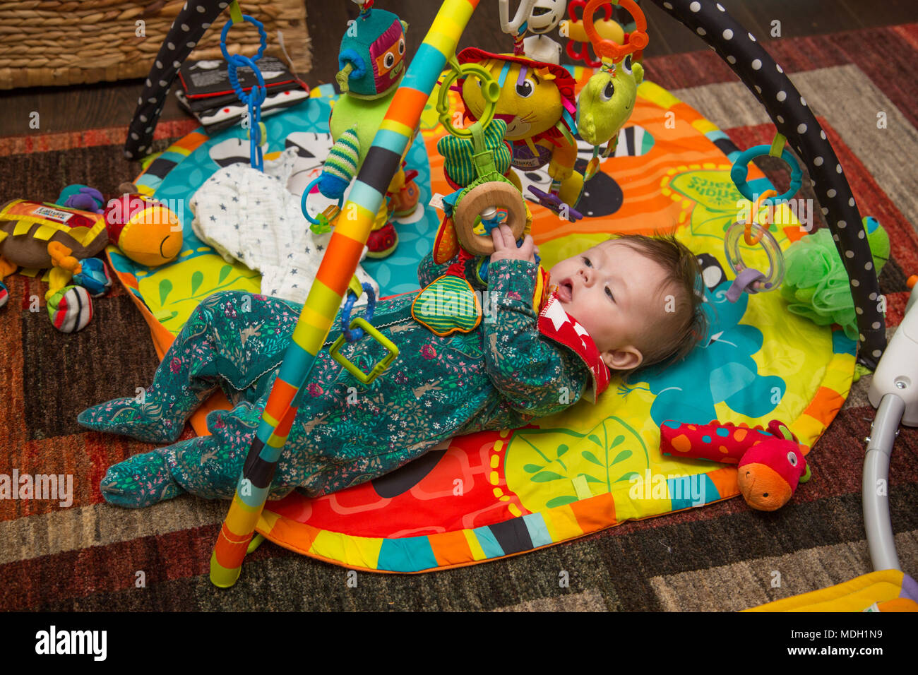 Baby playing on playmate Stock Photo 