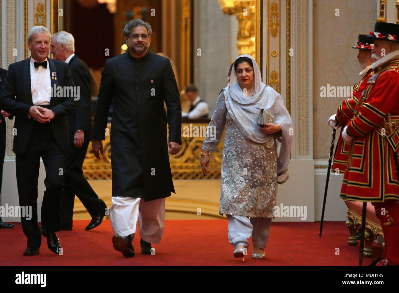Pakistan's Prime Minister Shahid Khaqan Abbasi arrives in the East Gallery at Buckingham Palace in London as Queen Elizabeth II hosts a dinner during the Commonwealth Heads of Government Meeting. Stock Photo