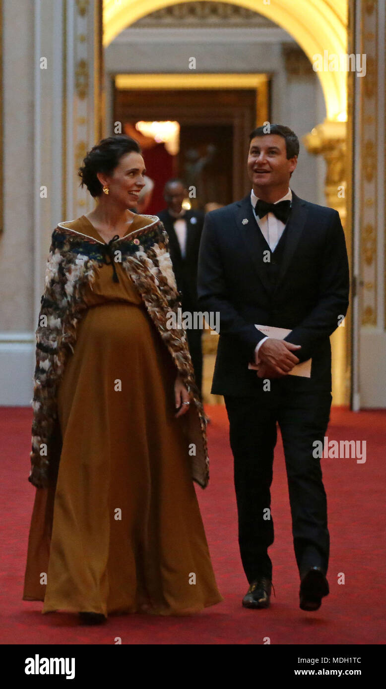 New Zealand's Prime Minister Jacinda Ardern and her partner Clarke Gayford arrive in the East Gallery at Buckingham Palace in London as Queen Elizabeth II hosts a dinner during the Commonwealth Heads of Government Meeting. Stock Photo