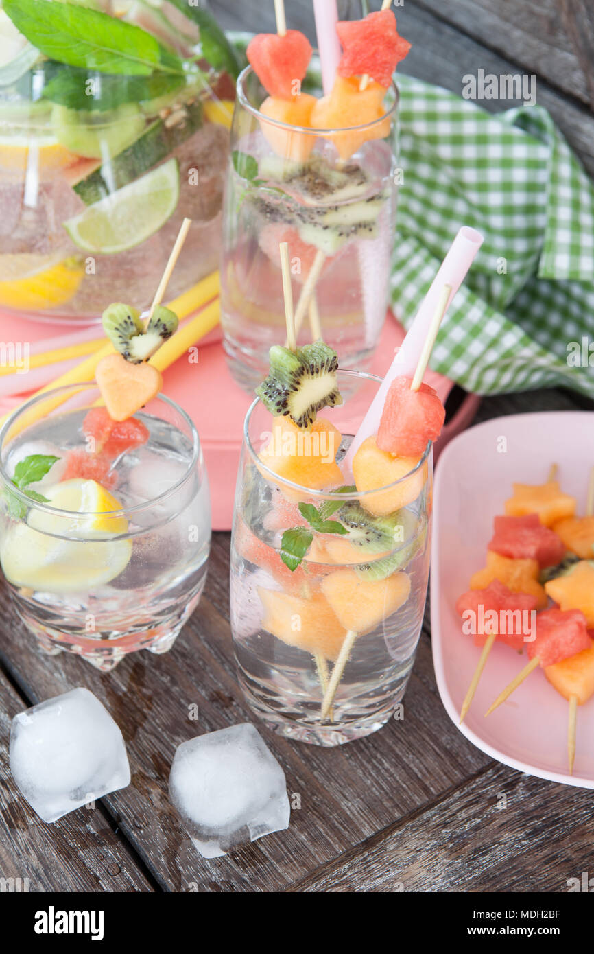 Ice cold sparkly drink with fresh fruits Stock Photo