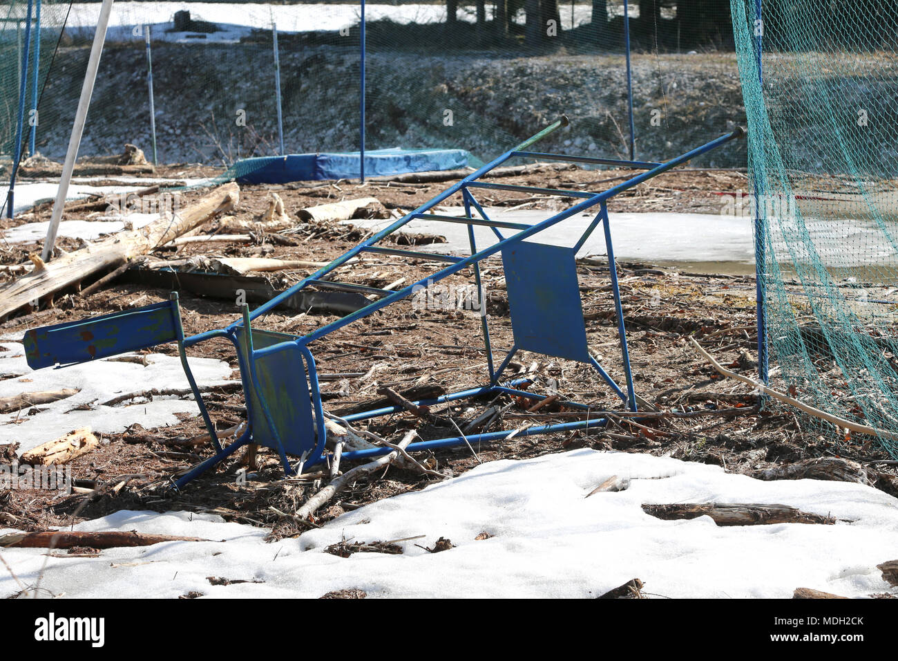 abandoned volleyball court completely destroyed with the judge's chair upside down Stock Photo