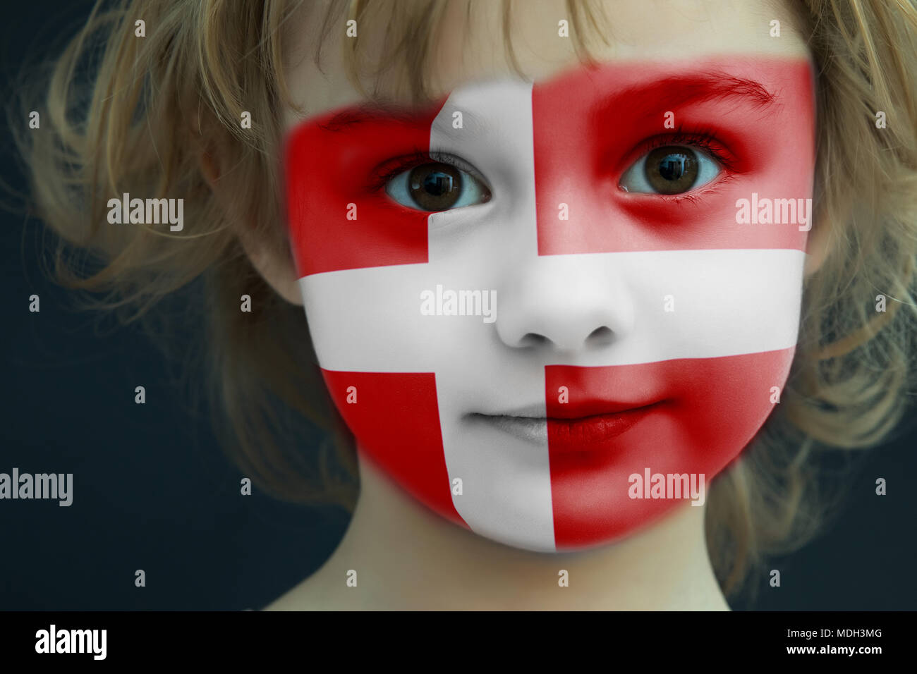 Child with a painted flag of Denmark Stock Photo