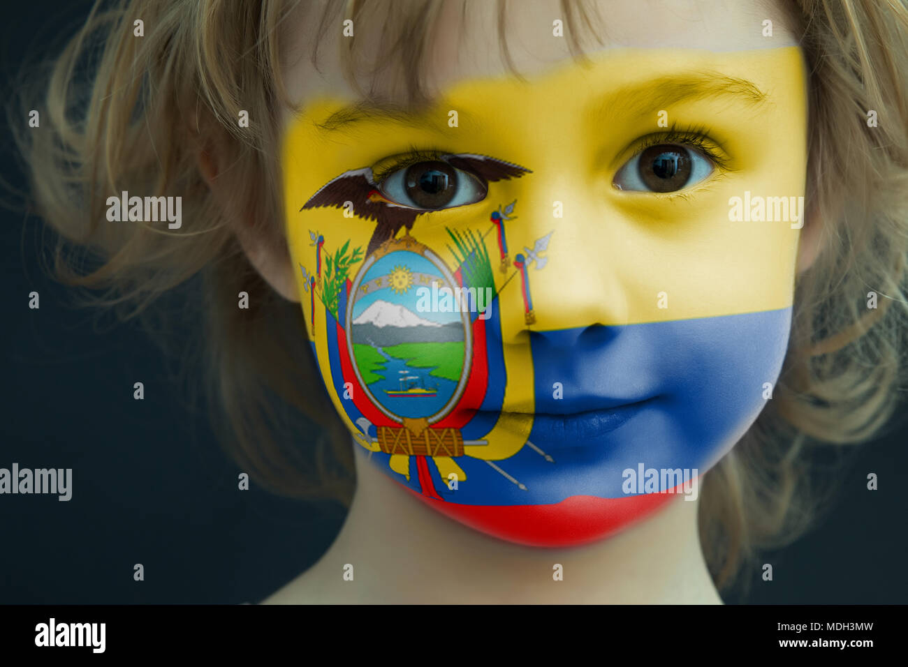 Child with a painted flag of Ecuador Stock Photo