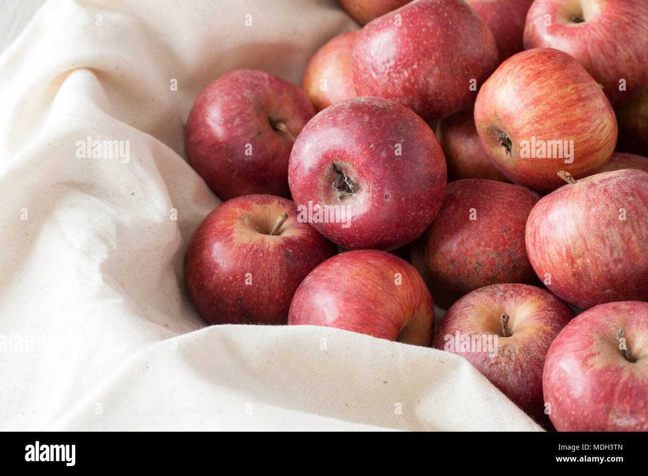 Top view of Annurca apples, cultivated in Southern Italy, typically at the border between the Caserta and Benevento provinces, in the valley which is  Stock Photo
