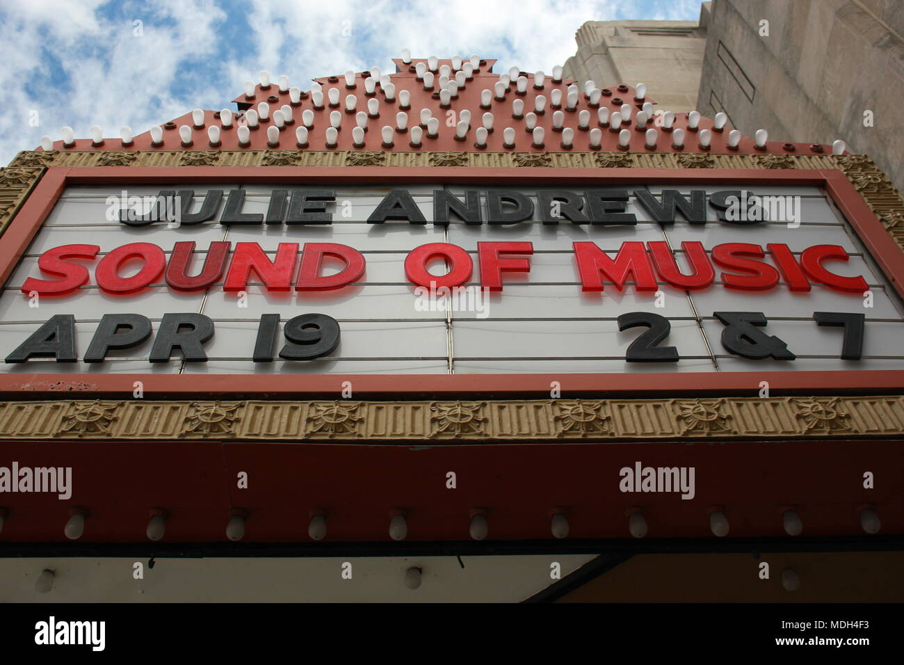 Proclaim theater marquee featuring Junkie Andrews and the movie 'The Sound of Music' in bold red and black rigid letters. Stock Photo