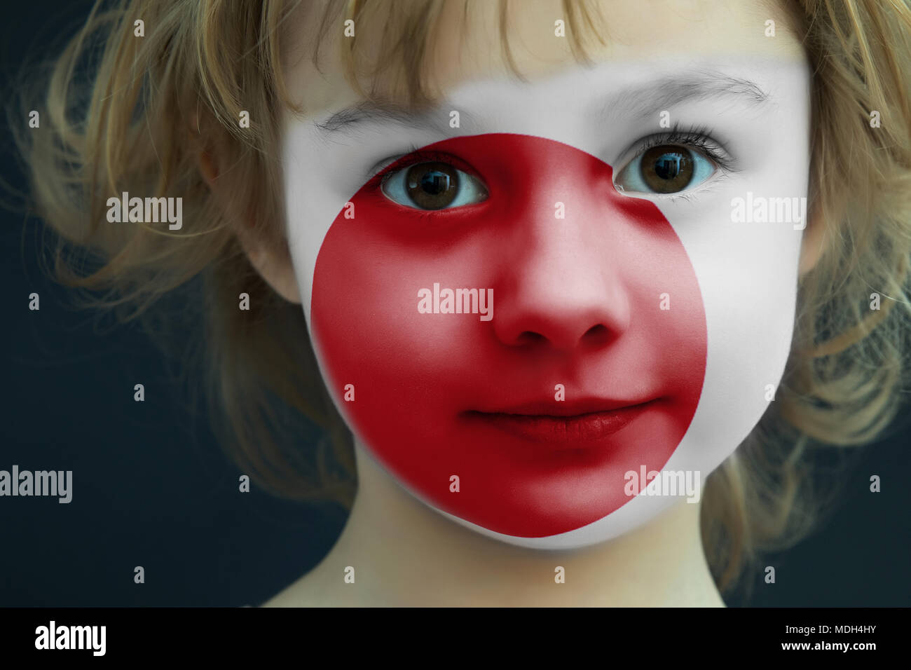 Child with a painted flag of Japan Stock Photo