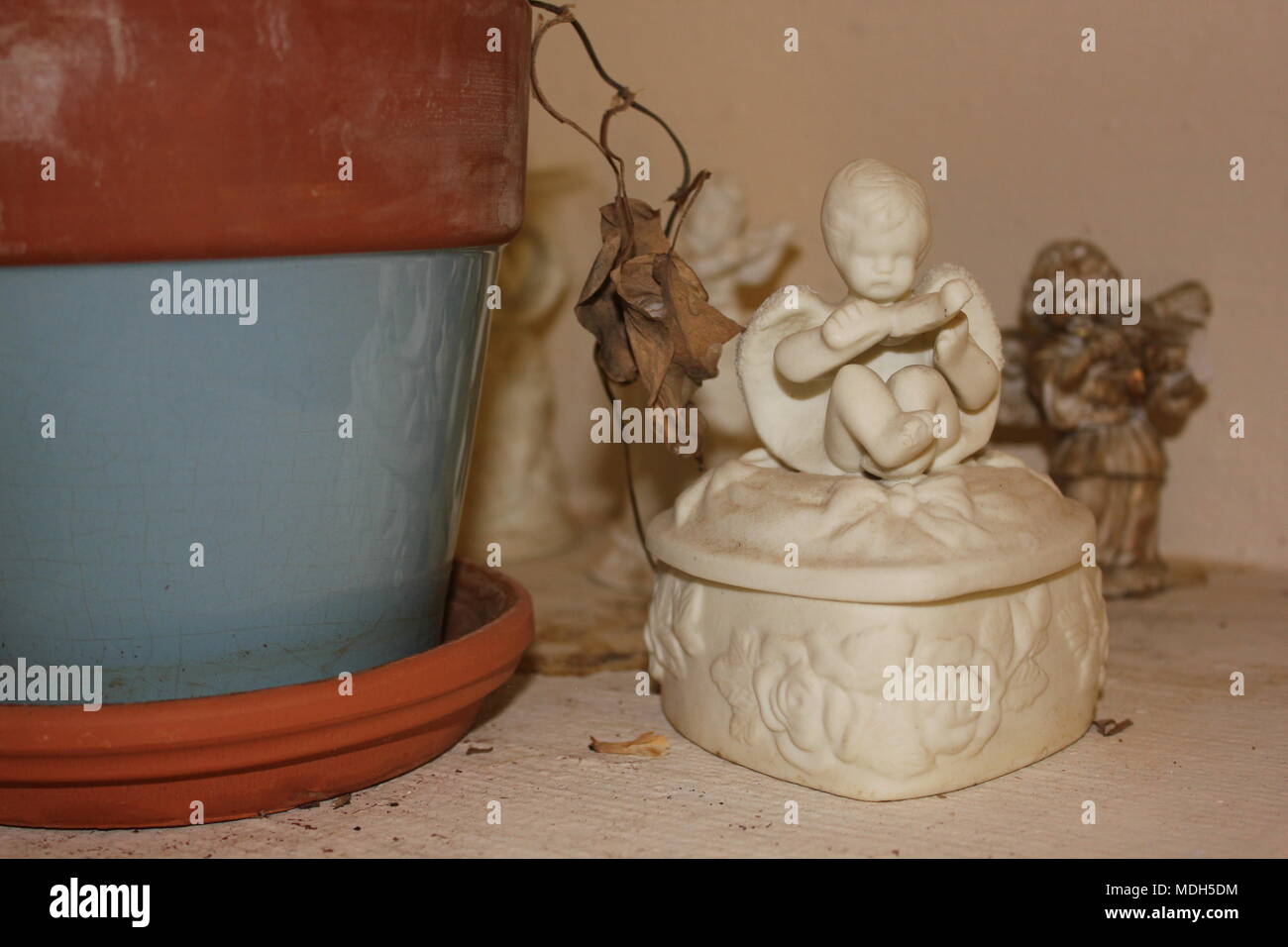 Set of violin playing angels set on a shelf. Stock Photo