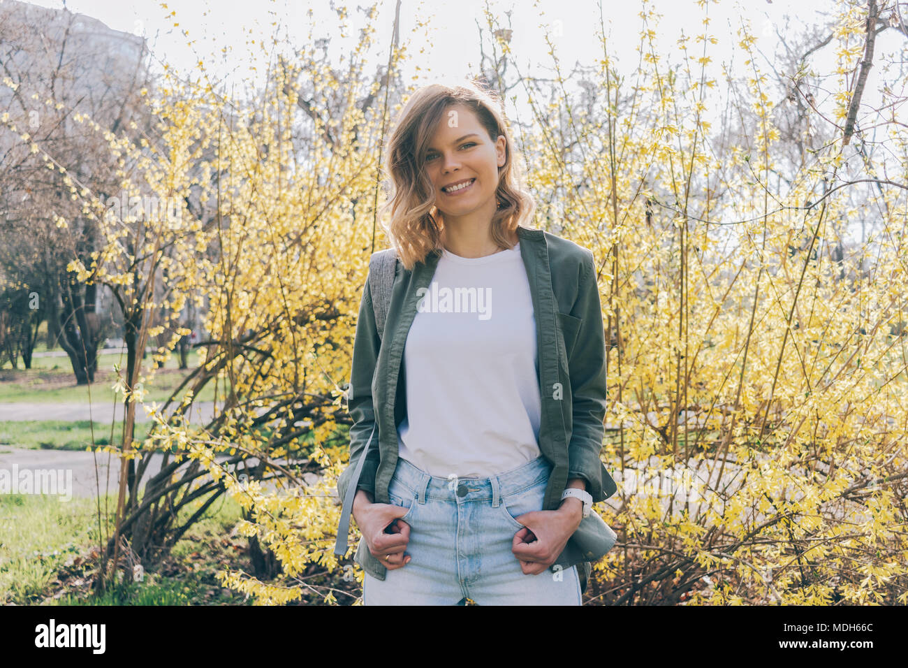 khaki shirt blue jeans