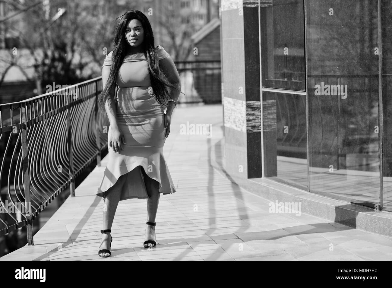 African american woman model xxl in orange dress Stock Photo Alamy