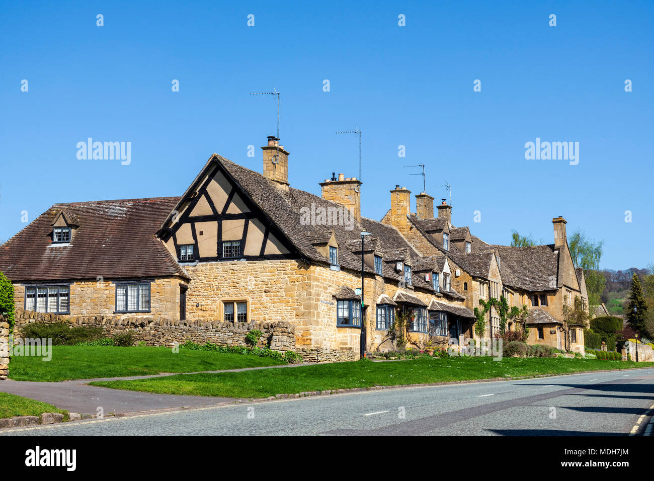 High Street, Broadway, Cotswolds on a sunny spring day with blue skies. Stock Photo
