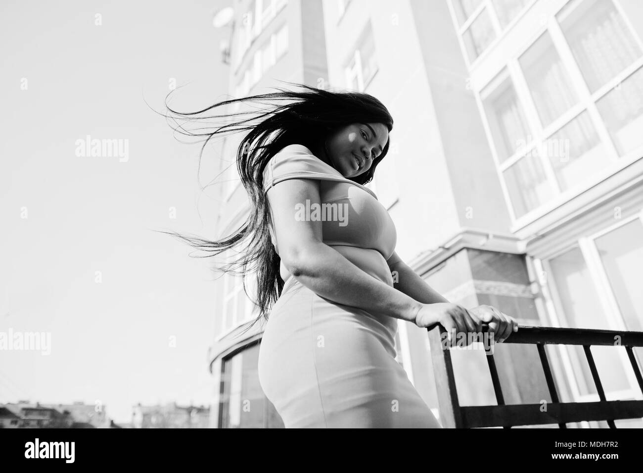 African american woman model xxl in orange dress Stock Photo Alamy