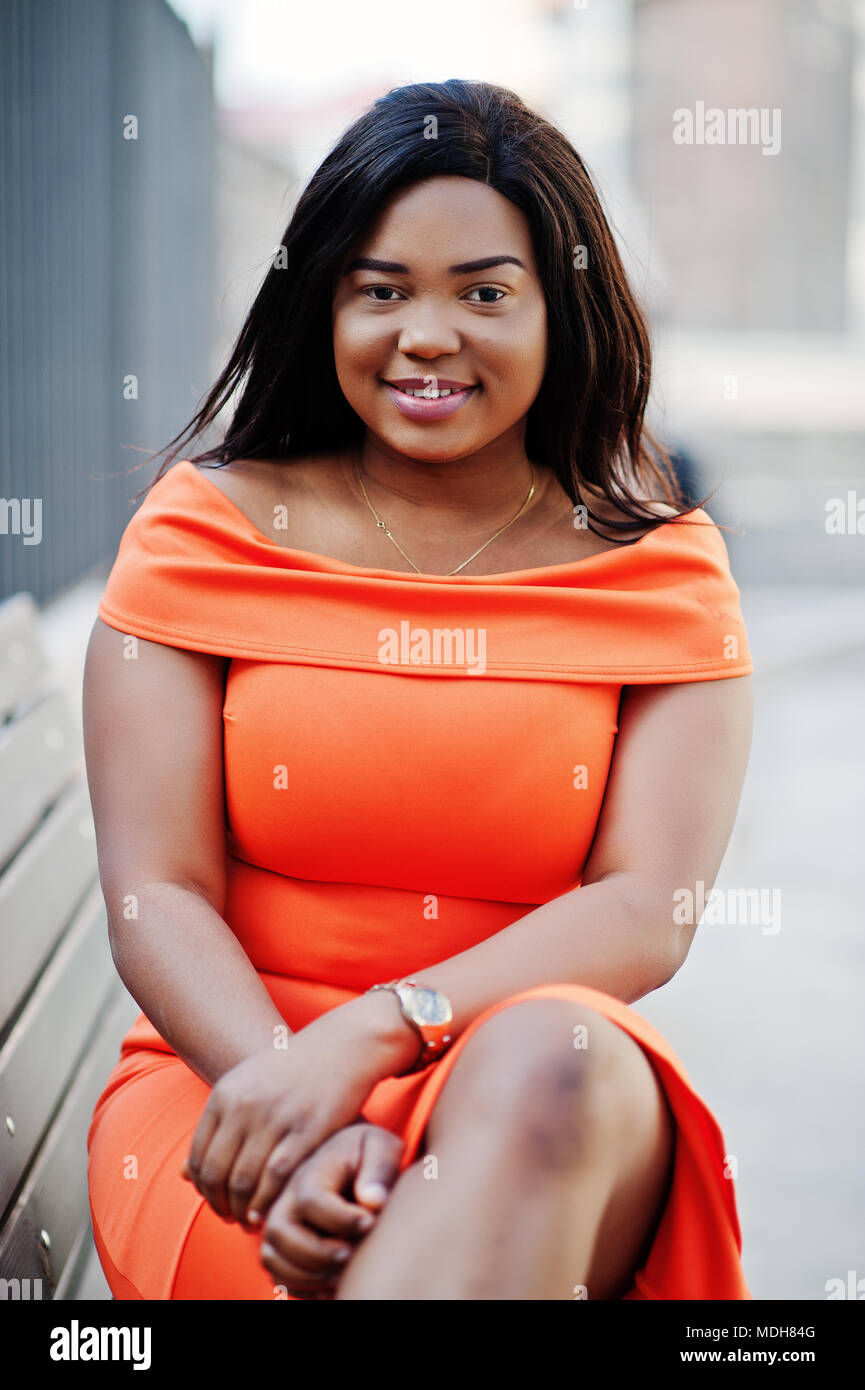 African american woman model xxl in orange dress Stock Photo Alamy