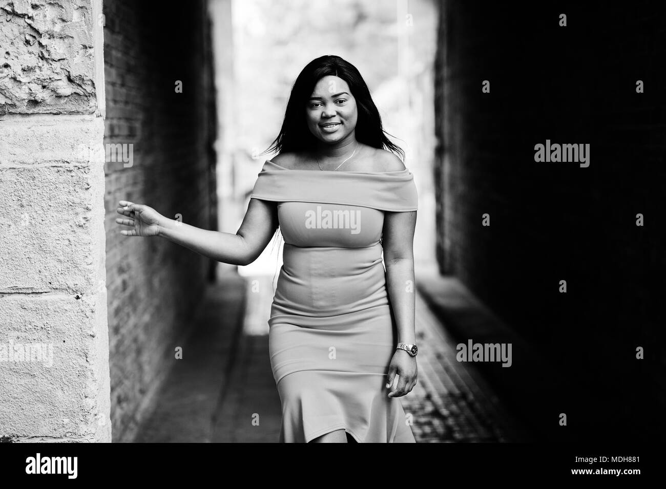 African american woman model xxl in orange dress Stock Photo Alamy