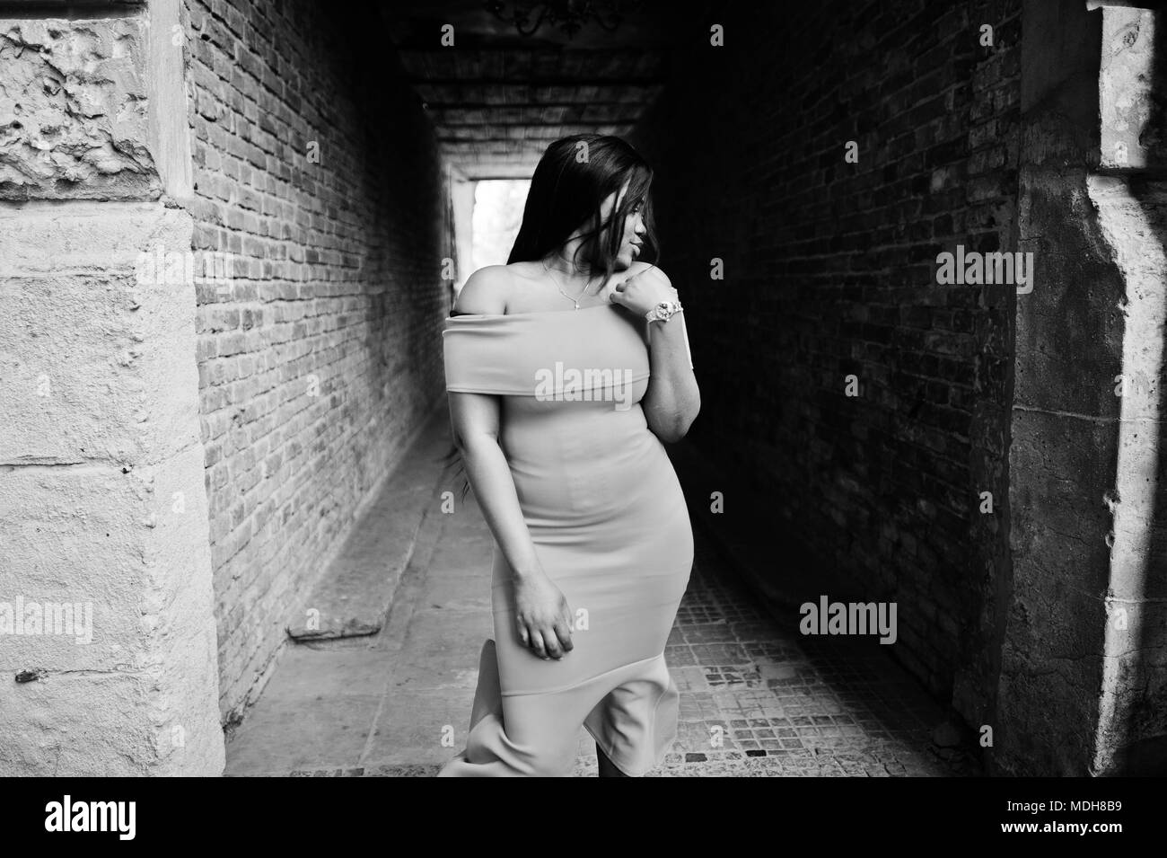 African american woman model xxl in orange dress Stock Photo Alamy