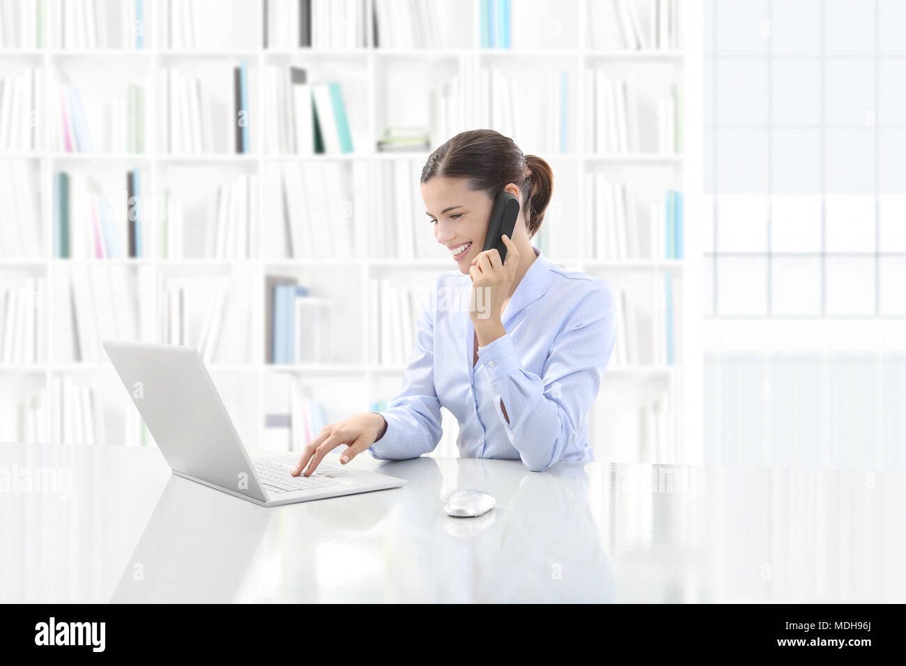 Business smiling woman or a clerk working at her office desk with