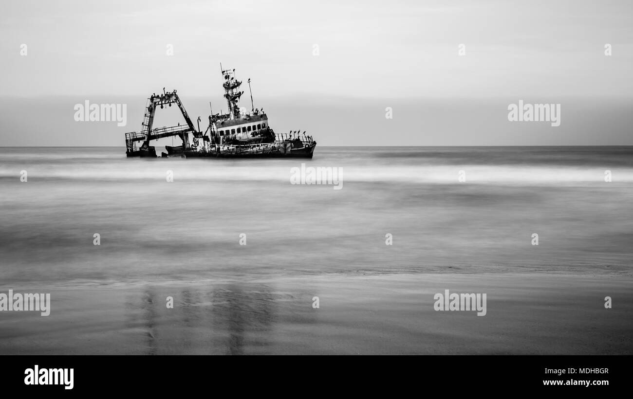 Black and white image of a shipwreck on Skeleton Coast; Sossusvlei, Hardap Region, Namibia Stock Photo