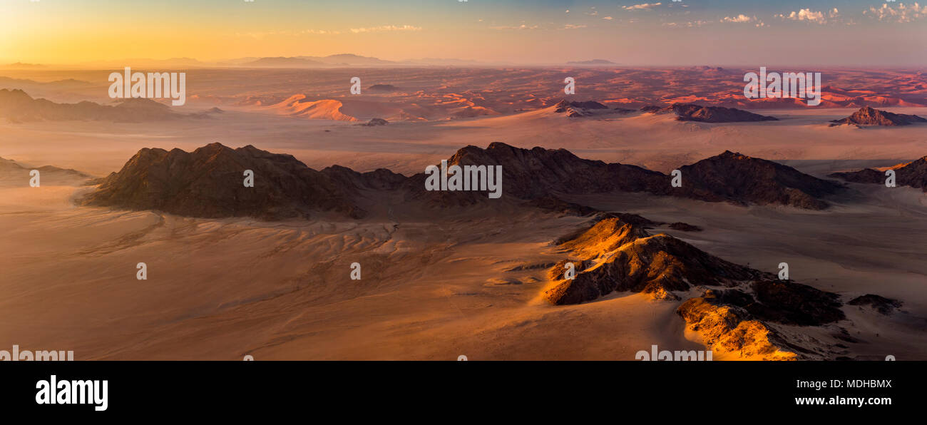 Aerial view of the sand dunes of the Namib Desert at sunrise; Sossusvlei, Hardap Region, Namibia Stock Photo