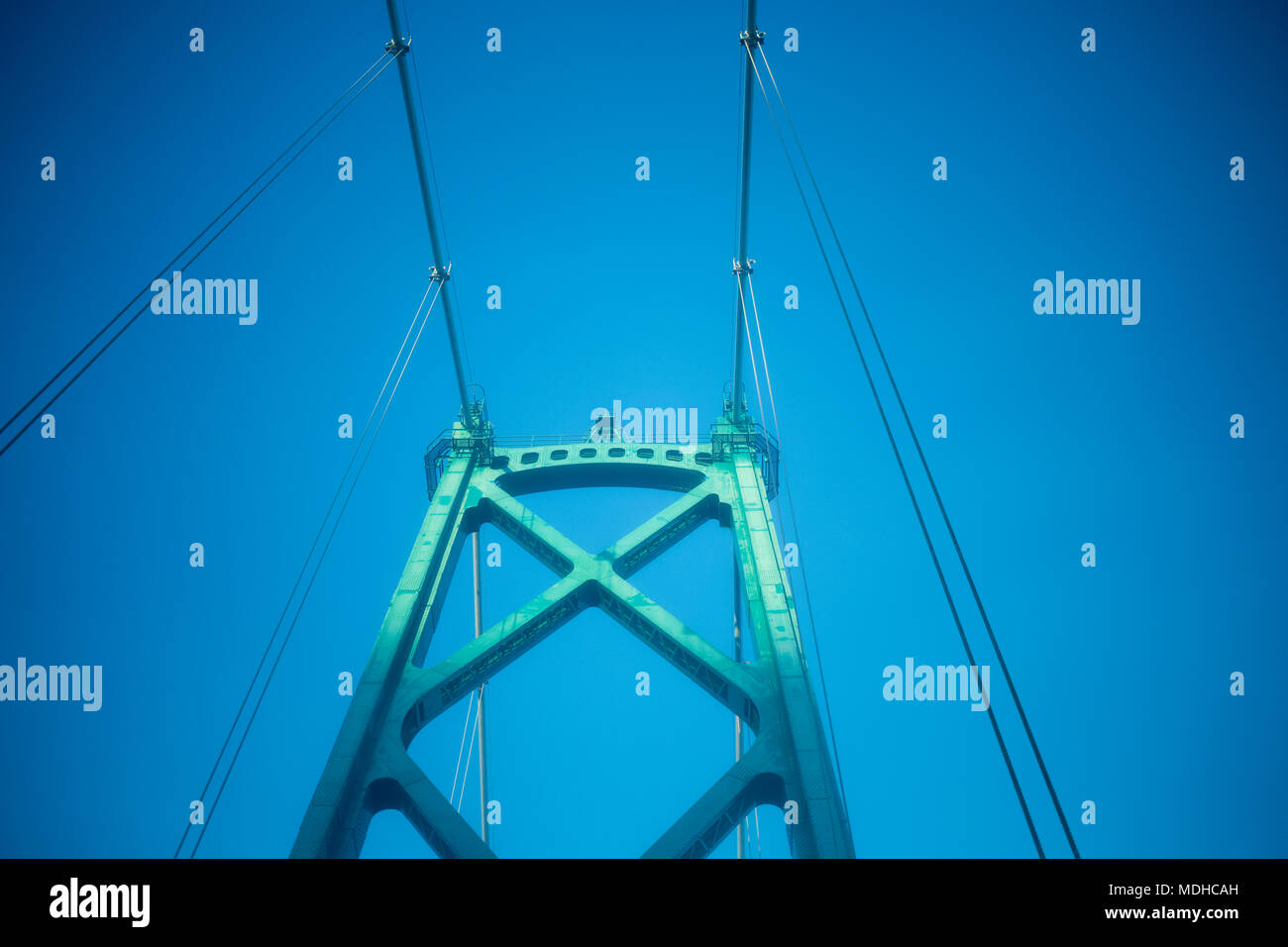 Architectural detail of the Lions Gate Bridge against a blue sky; Vancouver, British Columbia, Canada Stock Photo