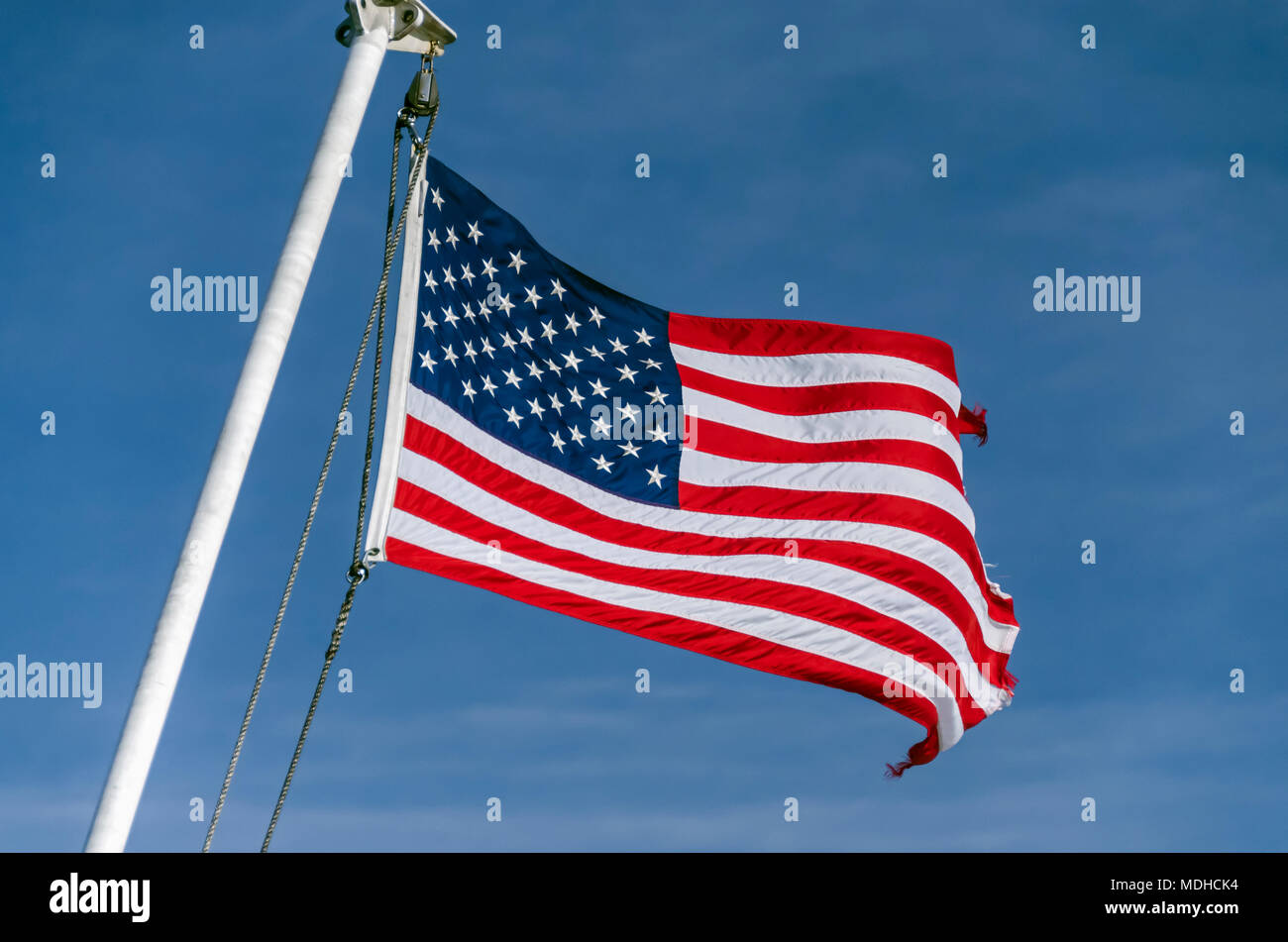 American flag flying at the stern of the Alaska Marine Highway System ferry MV LeConte between Juneau and Gustavus, Alaska Stock Photo