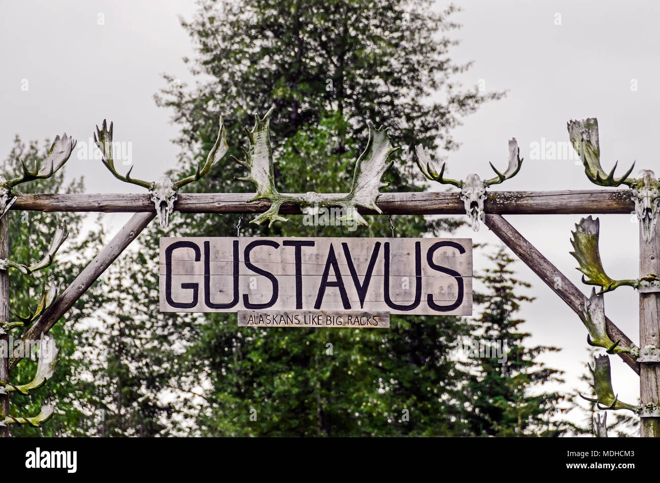 Gustavus sign on front lawn of house near ferry dock in Gustavus, Alaska Stock Photo