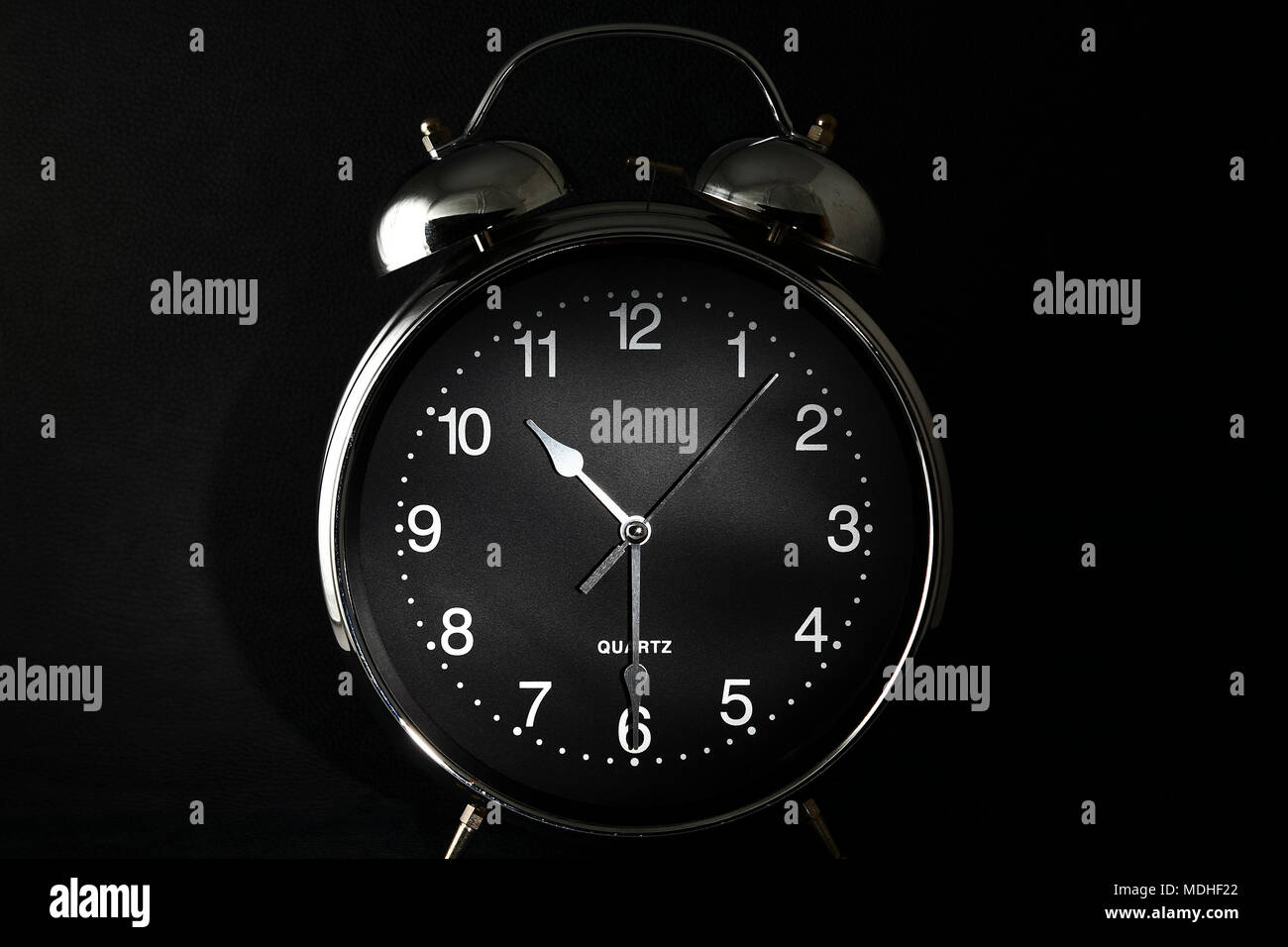 Old retro alarm clock with the hands set to 10:30 am or pm Stock Photo -  Alamy