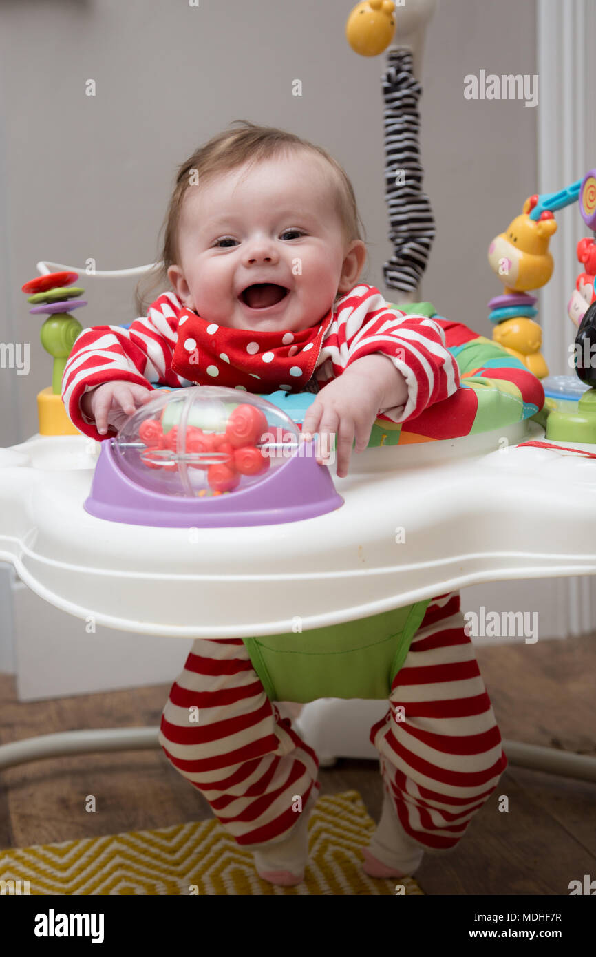 Baby in Jumperoo Stock Photo Alamy