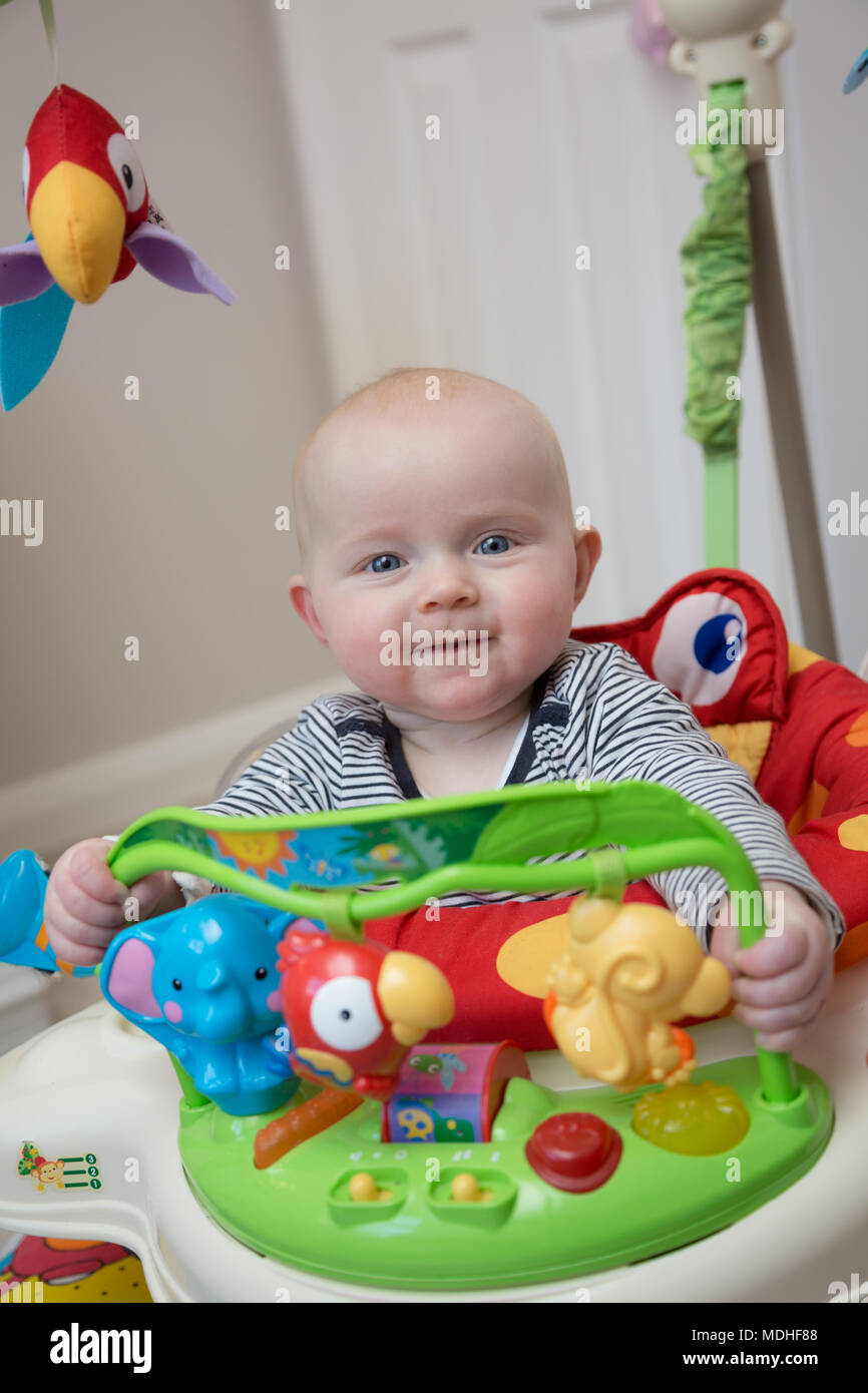 Baby in Jumperoo Stock Photo Alamy