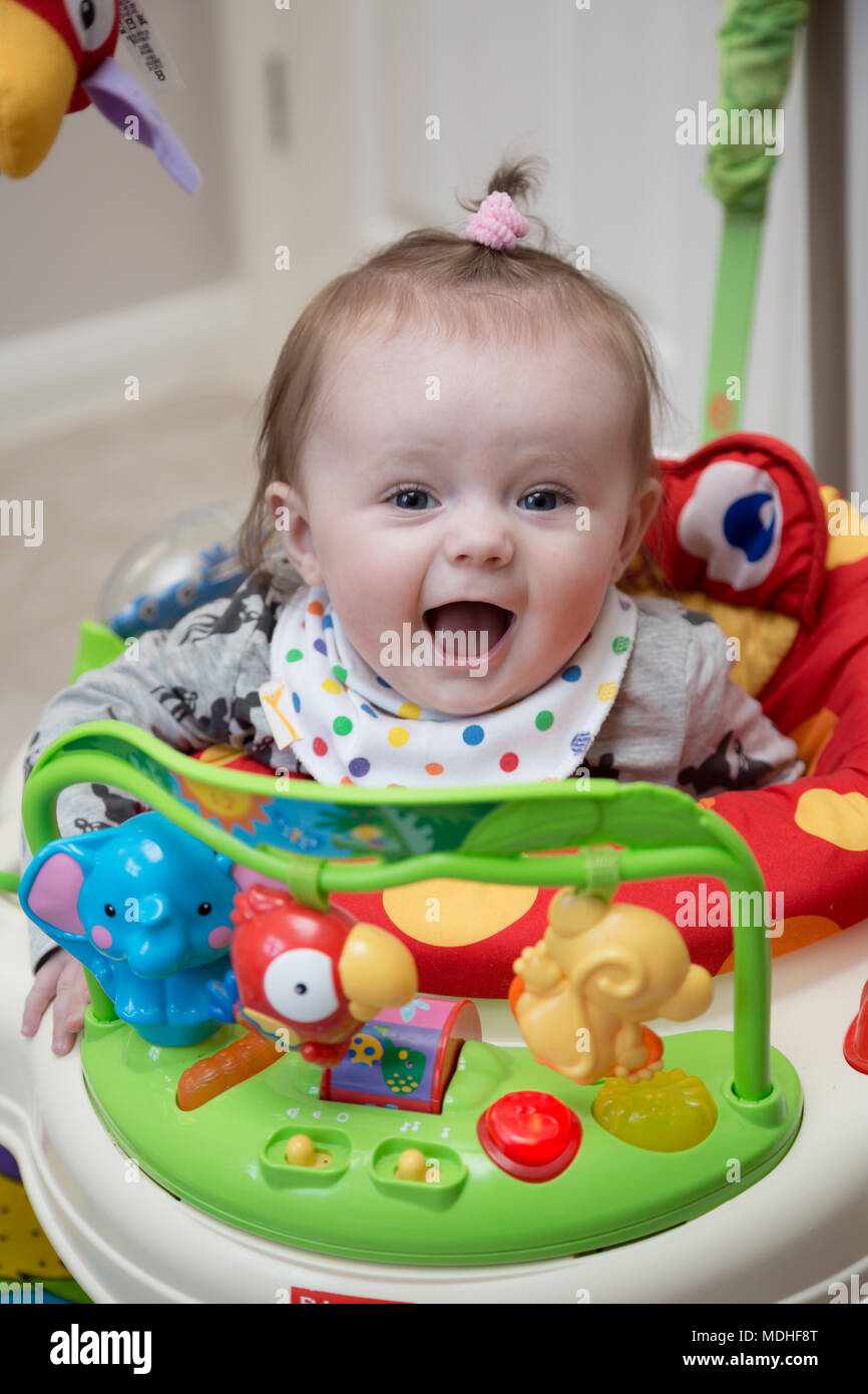 Baby in Jumperoo Stock Photo Alamy