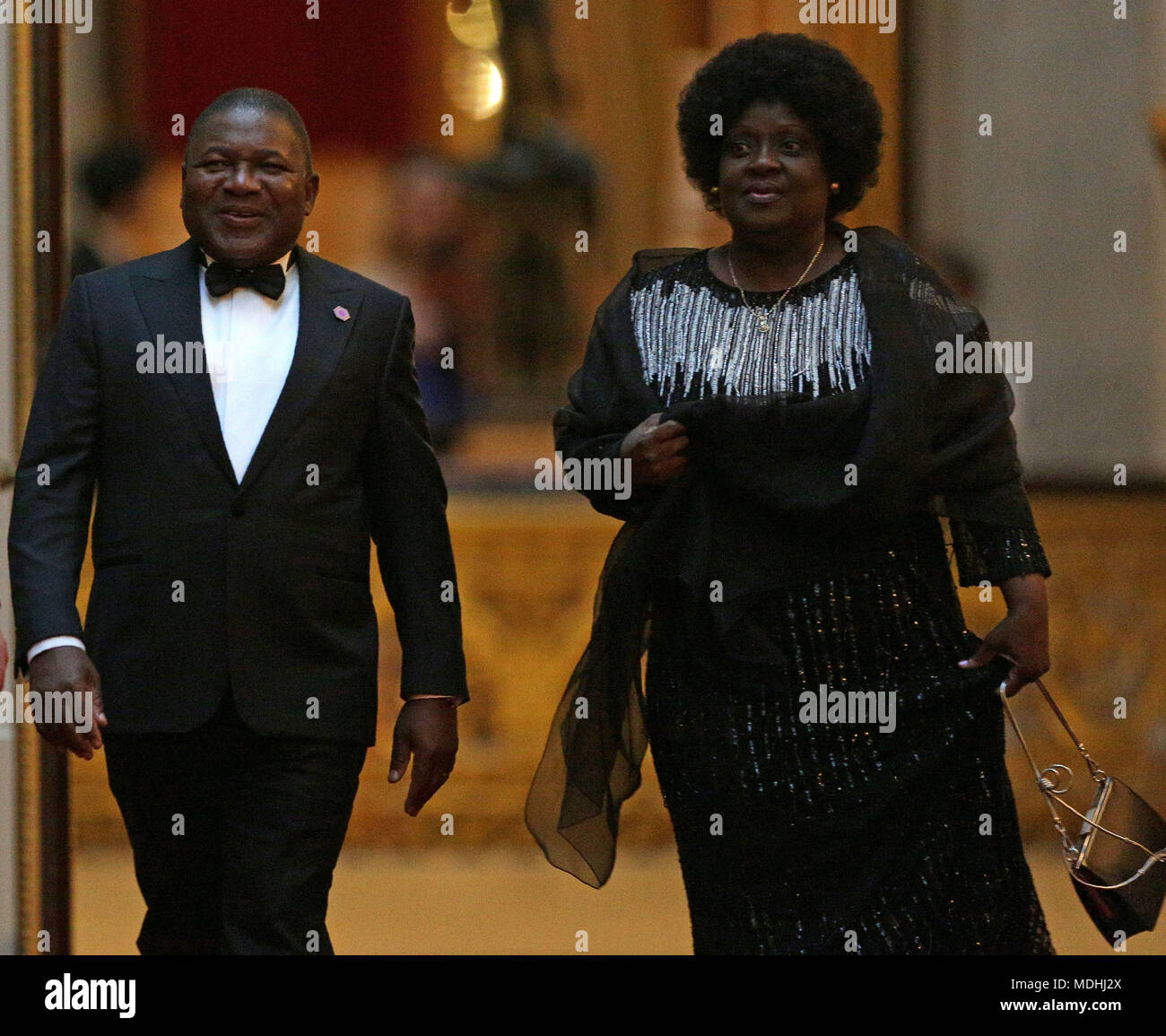 Mozambique's President Filipe Nyusi and his wife Isaura arrive in the East Gallery at Buckingham Palace in London as Queen Elizabeth II hosts a dinner during the Commonwealth Heads of Government Meeting. Stock Photo