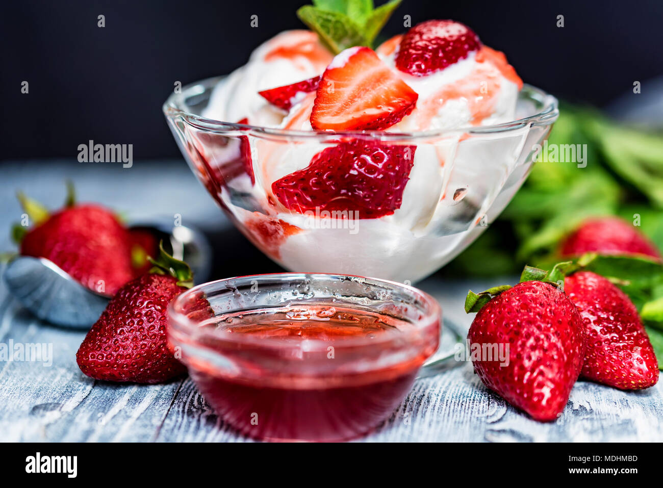 Strawberry ice cream with mint in bowl and jam Stock Photo - Alamy