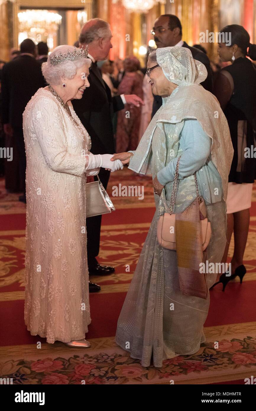 Queen Elizabeth II greets Sheikh Hasina, Prime Minister of Bangladesh, in the Blue Drawing Room at Buckingham Palace in London as she hosts a dinner during the Commonwealth Heads of Government Meeting. Stock Photo
