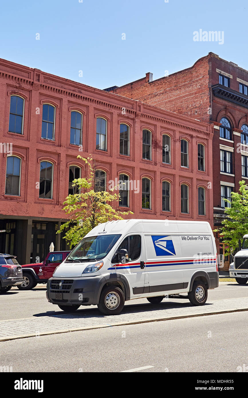 New modern U.S. Postal Service delivery van or mail truck parked on a
