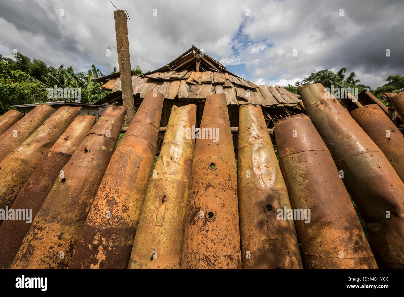 Wall made from bomb casings in Na Kam Peng, also called Bomb Village; Na Kam Peng, Xiangkhouang, Laos Stock Photo