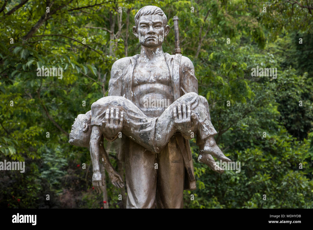 Memorial statue by Tham Piu Cave, place where on 24 November 1969, a single rocket fired from a US aircraft killed an estimated 374 people who had ... Stock Photo