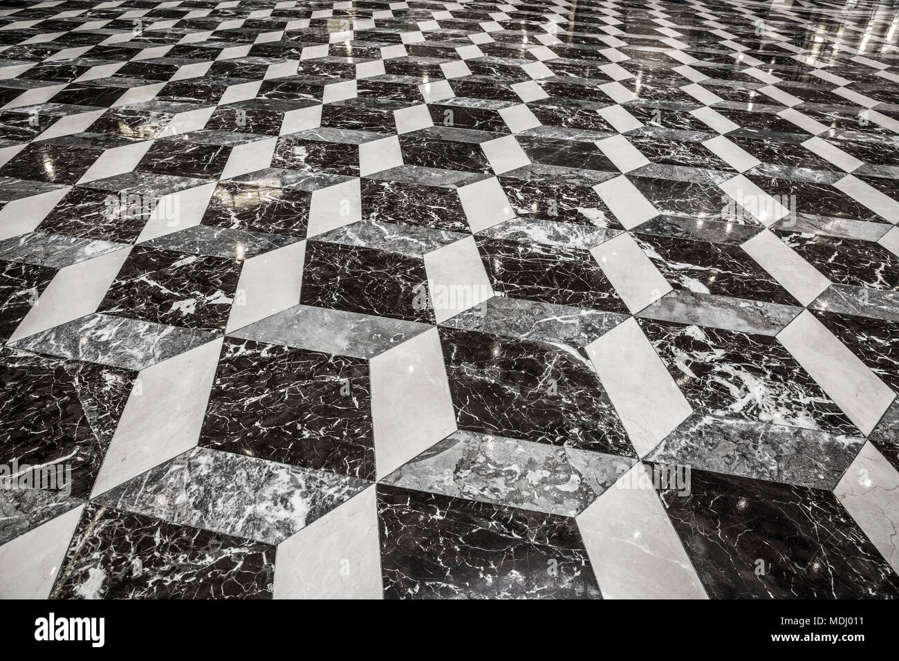 Floor of an office building that looks three-dimensional in a geometric pattern of black and white; Connecticut, United States of America Stock Photo