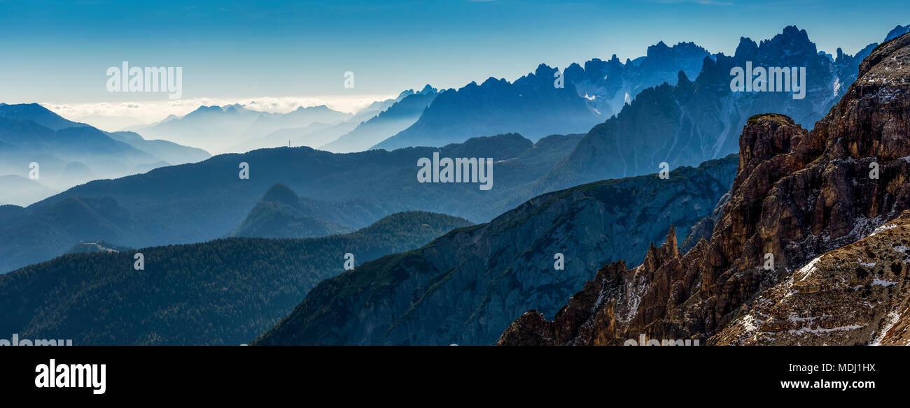 Panorama of silhouetted rugged mountain range; Sesto, Bolzano, Italy Stock Photo