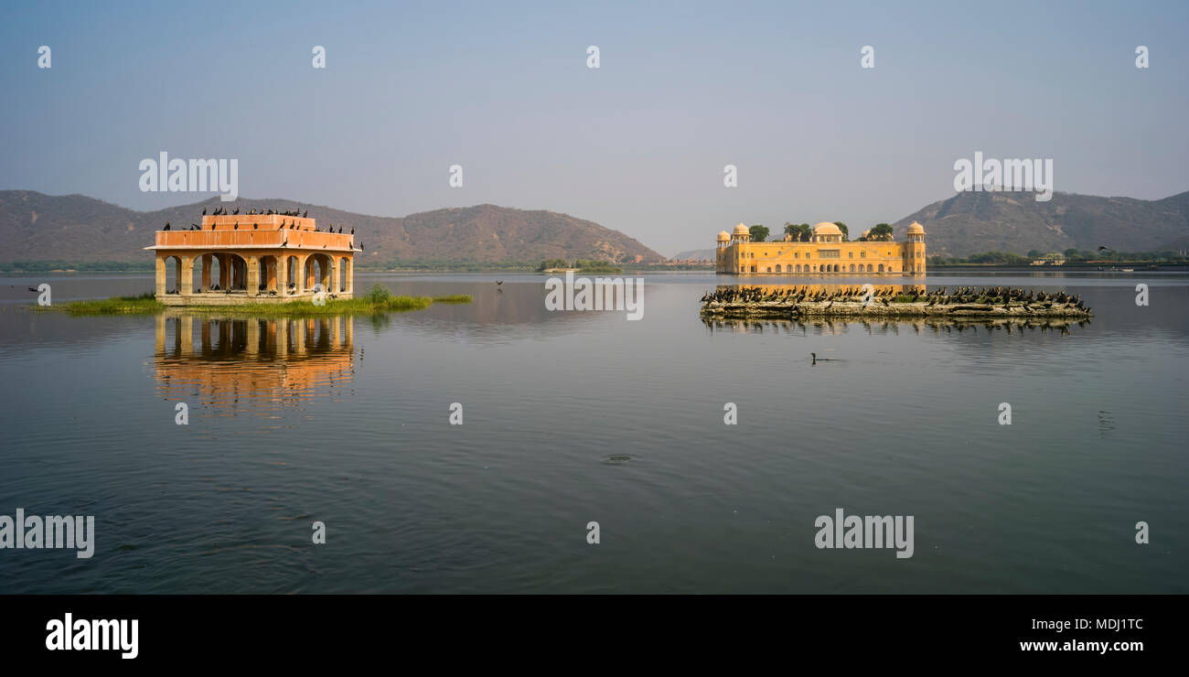 Jal Mahal Palace, made of red sandstone, sitting submerged in Man Sagar Lake; Jaipur, Rajasthan, India Stock Photo