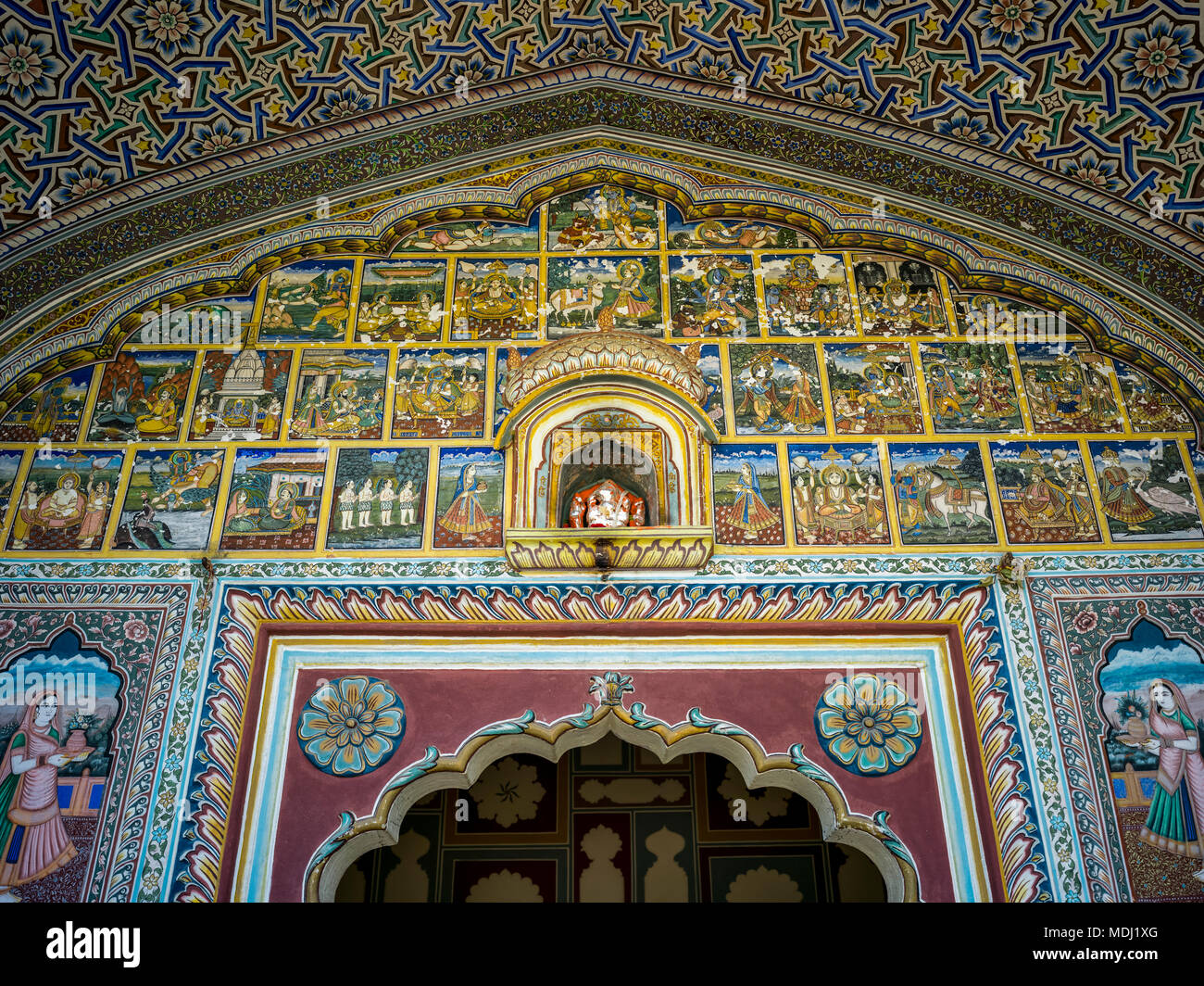 Interior decor with ornately designed walls in Samode Haveli Hotel