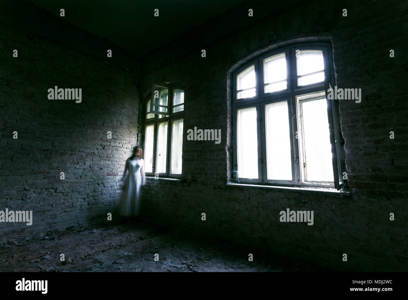 Horror ghost girl in abandoned building Stock Photo