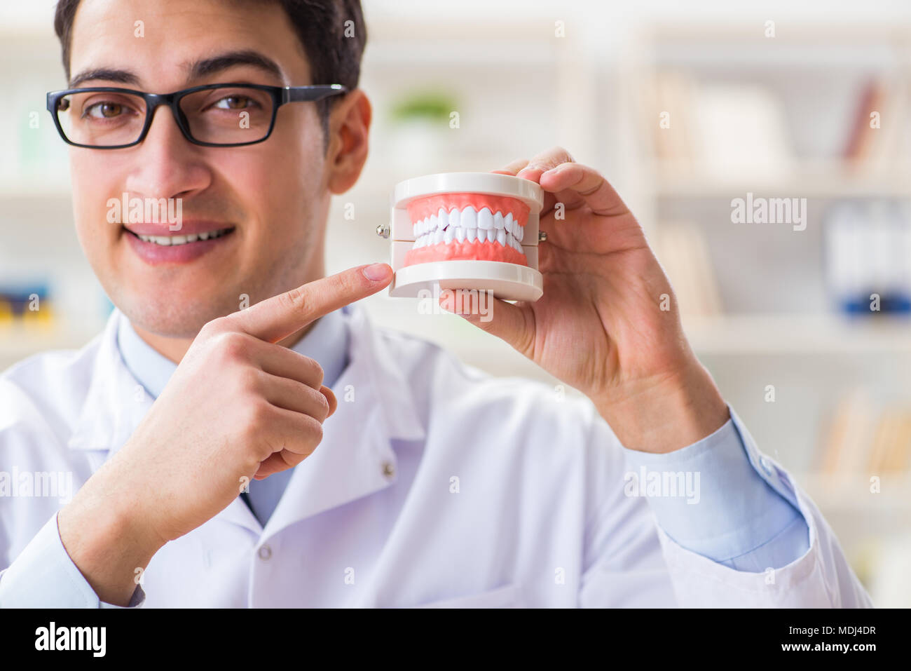 Young dentist working in the dentistry hospital Stock Photo Alamy