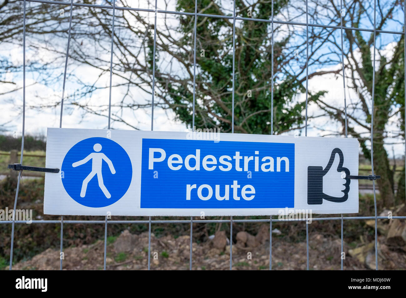 Pedestrian route sign on a construction site UK Stock Photo