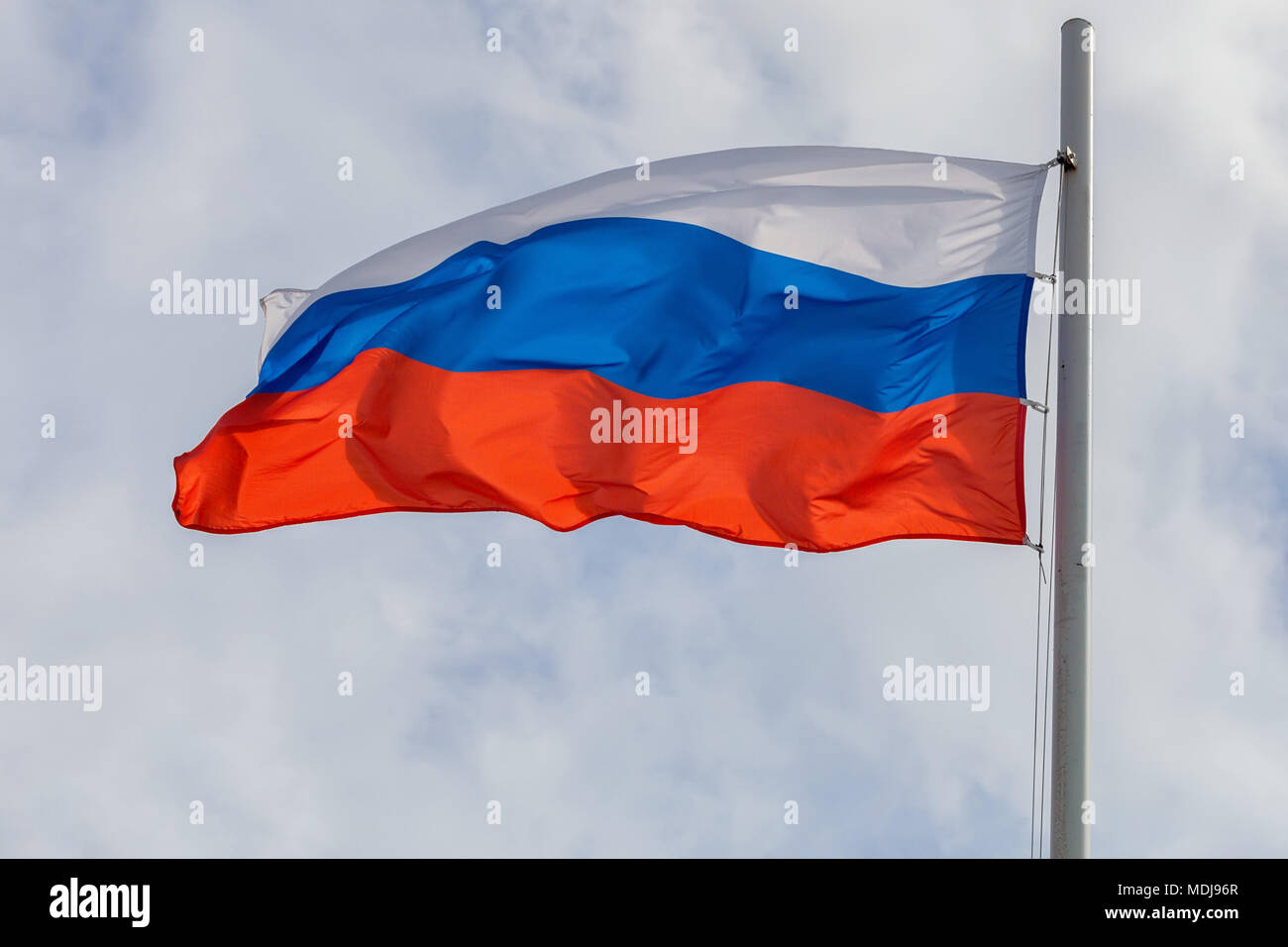 Russian flag on sky and cloud background Stock Photo