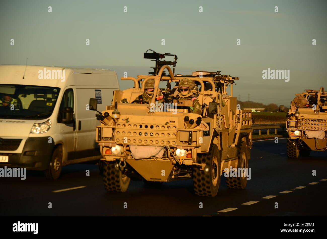 Army convoy on the motorway, Armoured Personnel Carrier Stock Photo
