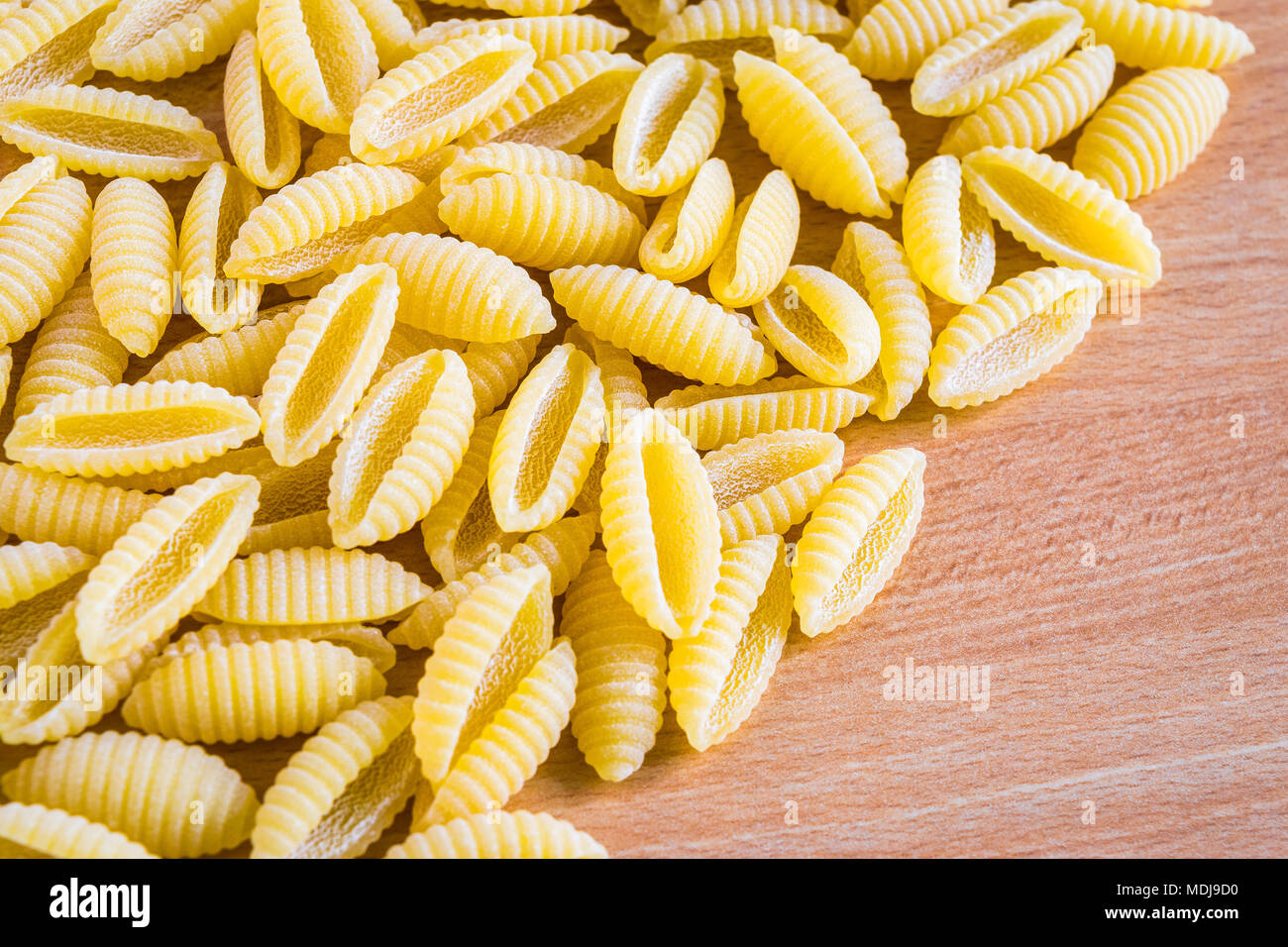 Italian pasta (gnocchetti sardi) on a wooden table Stock Photo