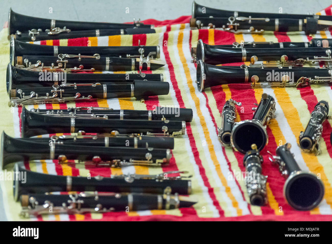 several clarinets resting on a beach towel at rehearsal Stock Photo